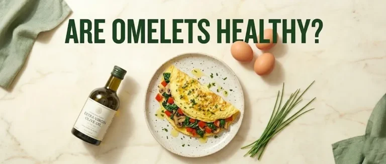 A vegetable omelet with spinach and peppers on a plate, surrounded by eggs and olive oil, asking are omelets healthy.