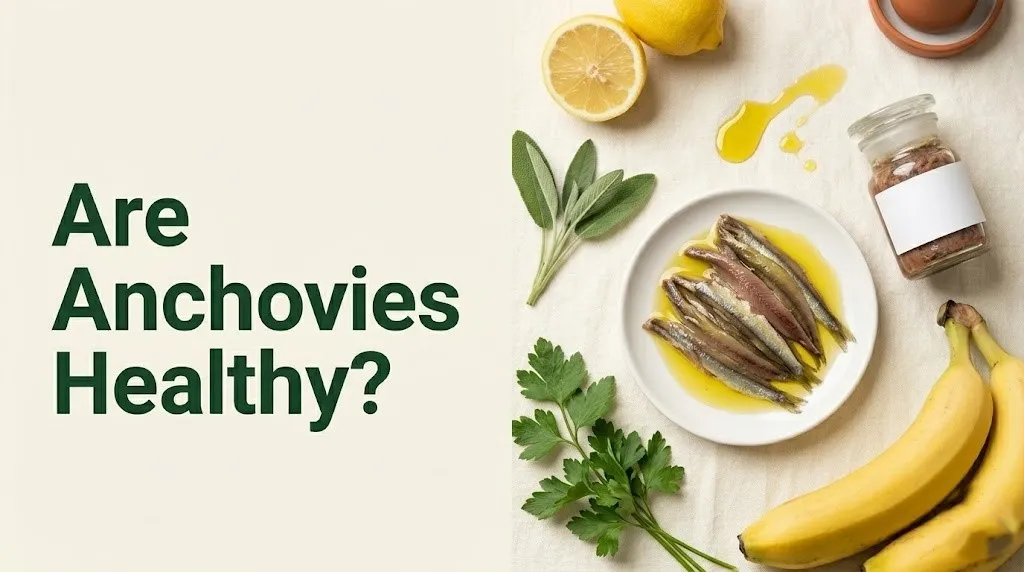 Are anchovies healthy guide showing anchovy fillets, anchovy paste, and olive oil on a white ceramic plate.