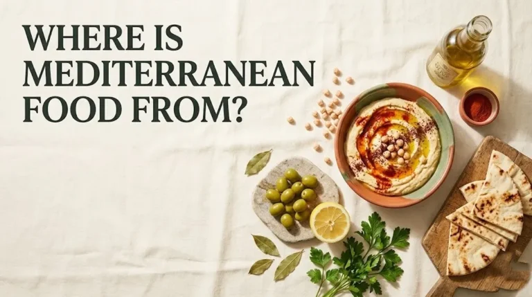 Overhead flat-lay of Mediterranean food ingredients including hummus, olive oil, chickpeas, and pita, with headline Where Is Mediterranean Food From