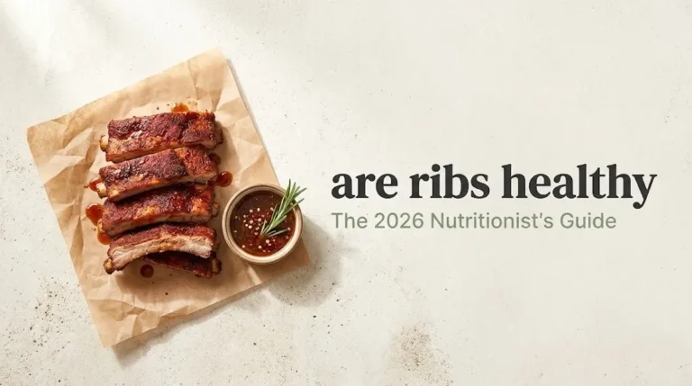 Overhead flat-lay of spice-crusted baby back ribs on butcher paper next to the bold text are ribs healthy.